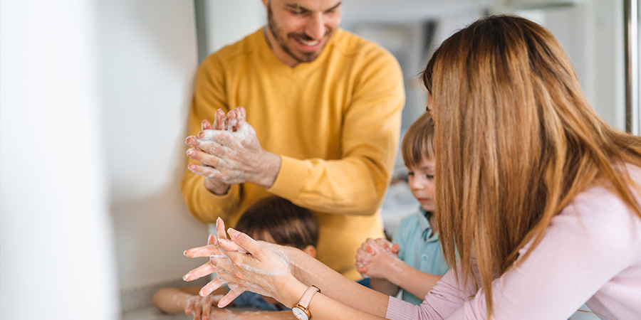 acsa residential services family washing hands with local water